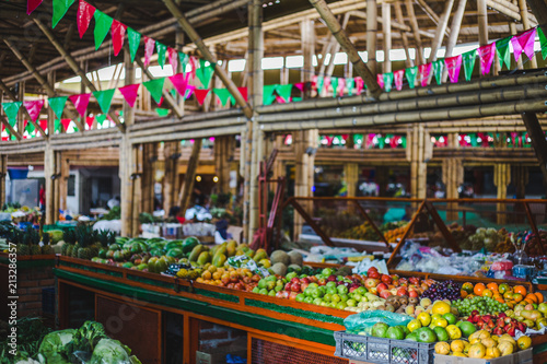 Colorful food market with red and green bunting in Cali, Colombia