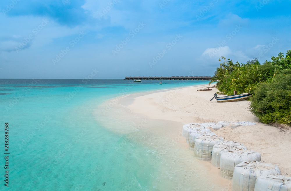 Fototapeta premium Beach degradation. Maldives will be washed away. Climate change evidence