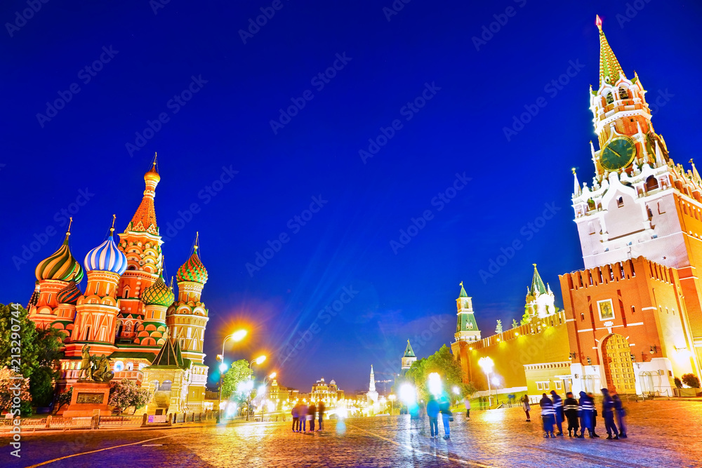 View of the Kremlin and St. Basil's cathedral on Red Square in Moscow at night.