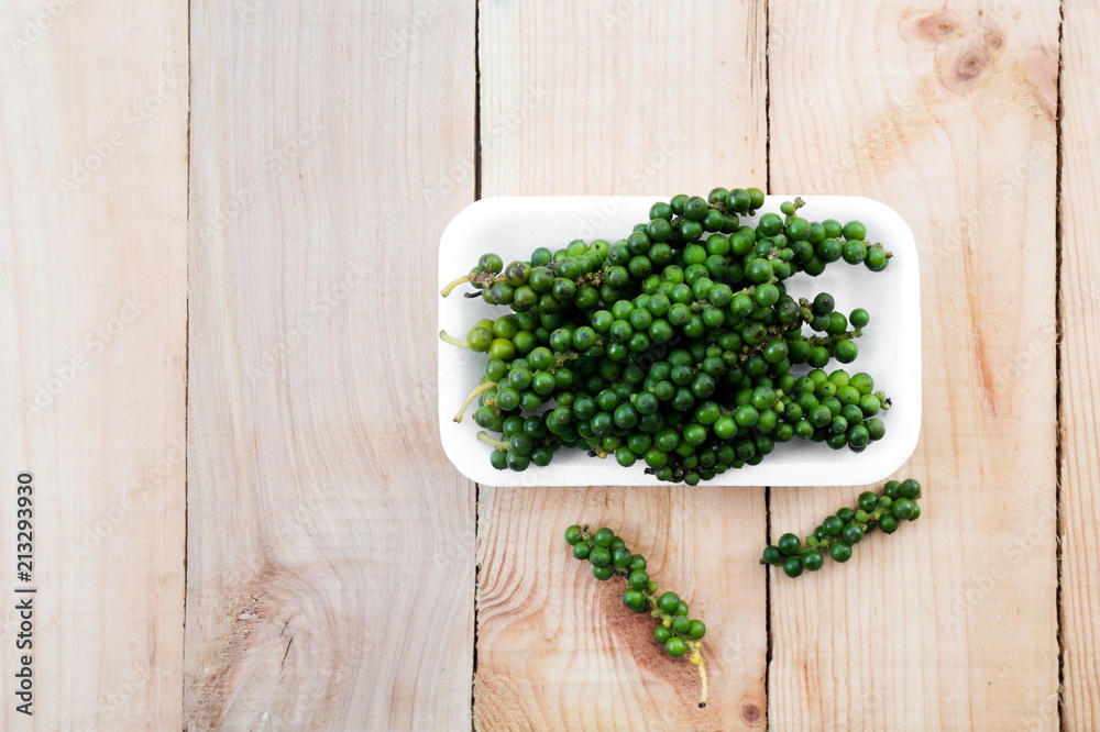 Fresh green Pepper nigrum on wooden table,Top view. Fresh green Pepper nigrum on wooden table,Top view.