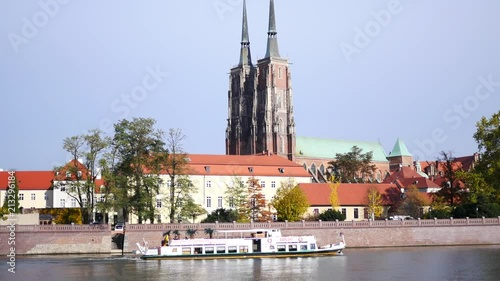 The beautiful architecture of Wroclaw and Odra River with waterbus photo