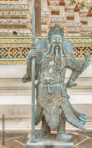 Statues at Wat Arun monumental Buddhist temple in Bangkok, Thailand. photo