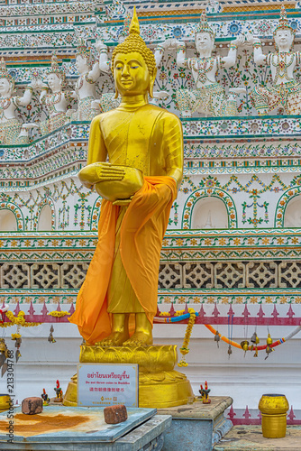 Golden Buddha statue at Wat Arun monumental Buddhist temple in Bangkok, Thailand. photo