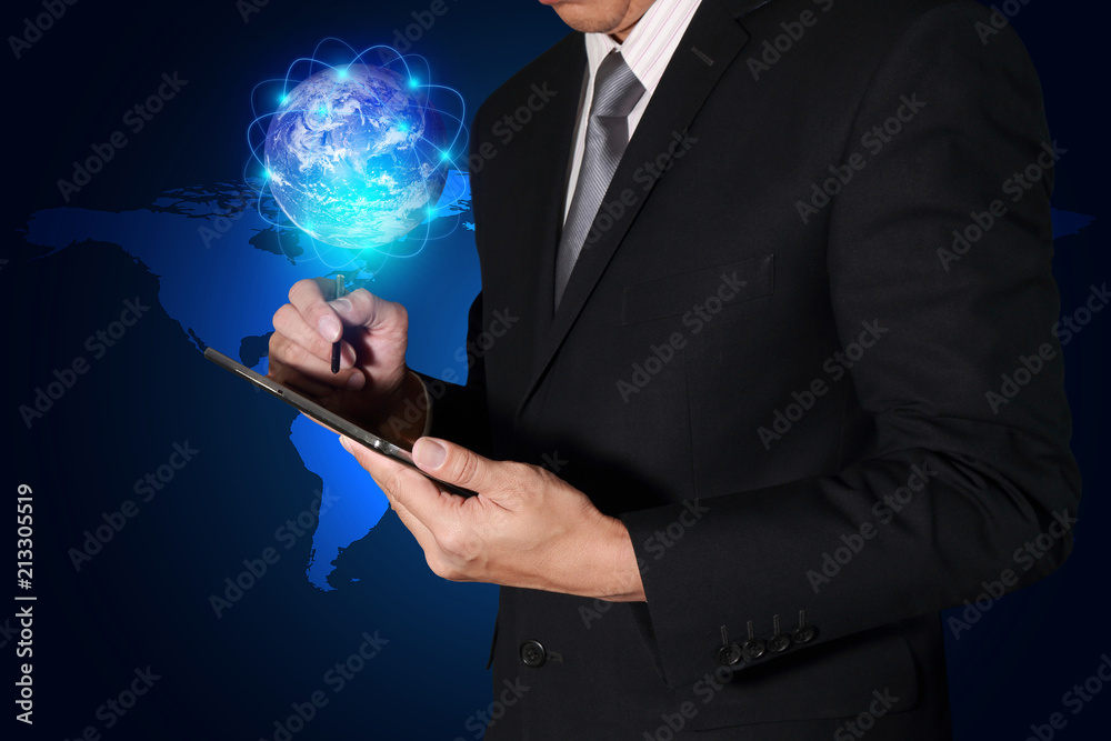 Businessman hand hold tablet and glowing node digital world on light blue earth map background as business technology, innovation and globalization concept. Elements of this image furnished by NASA Businessman hand hold tablet and glowing node digital world on light blue earth map background as business technology, innovation and globalization concept. Elements of this image furnished by NASA