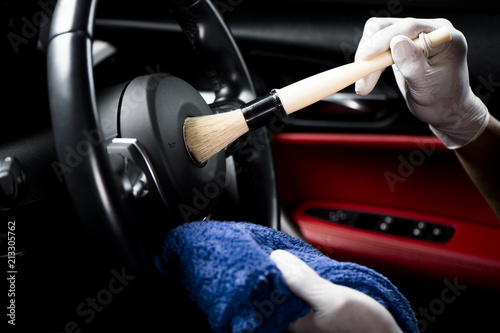 Cleaning car interior.