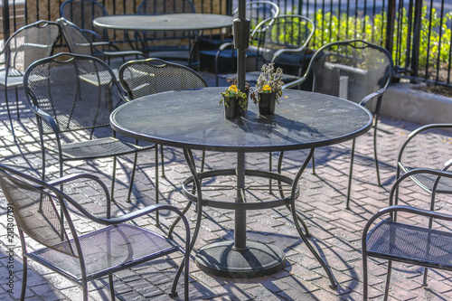 Metal table and chairs outside of shop