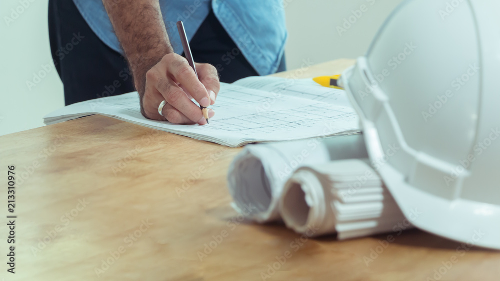 Architects who work on blueprints. Architect's Workplace - Architectural Blueprint Project Construction concept Engineering tools Side view Architects who work on blueprints. Architect's Workplace - Architectural Blueprint Project Construction concept Engineering tools Side view