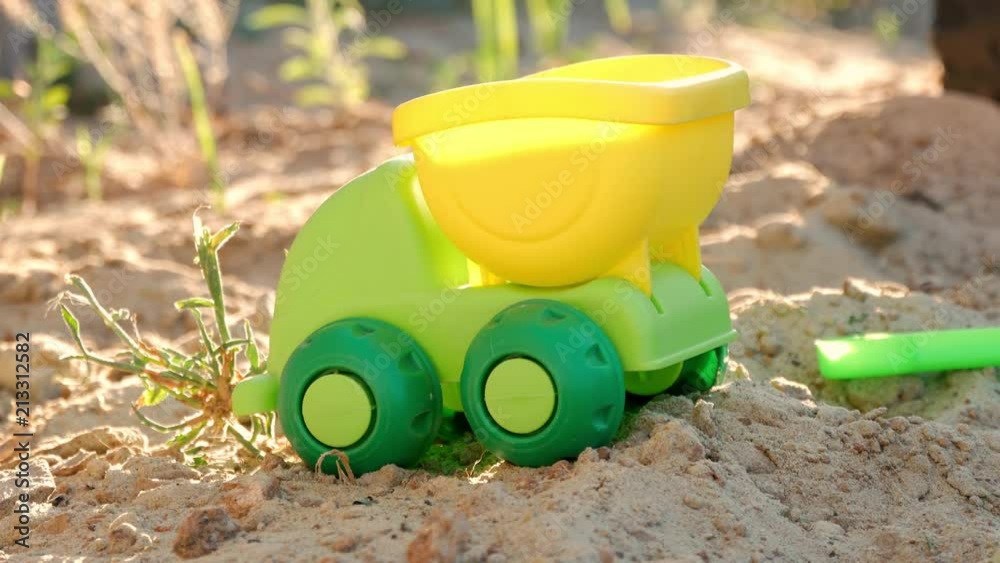 Toy car on the sand for child games. Toy car on the sand for child games.