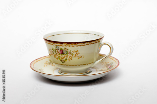 A porcelain tea cup in a saucer