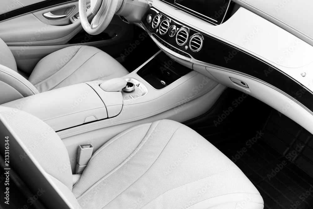 White leather interior of the luxury modern car. Leather comfortable