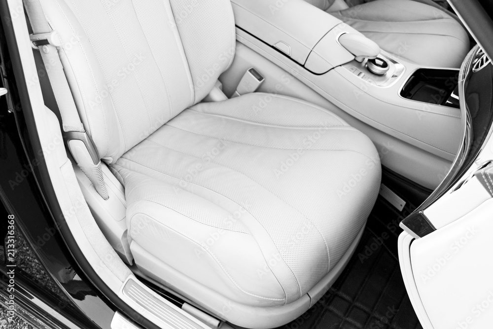 White leather interior of the luxury modern car. Leather comfortable