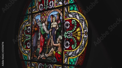 A beautiful stained glass window in an old church. photo
