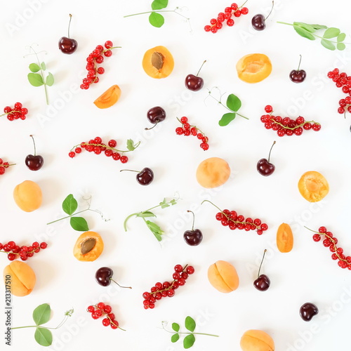 Fototapeta Naklejka Na Ścianę i Meble -  Summer yummy fruits, berry background, food colors pattern  from apricots, cherries, red currant  on a white background. Flat lay. Top view. 