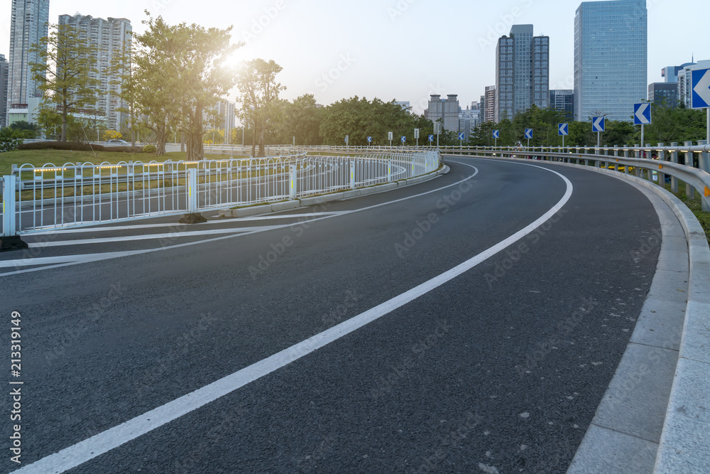 Obraz premium Prospects for expressway, asphalt pavement, city building commercial building, office building
