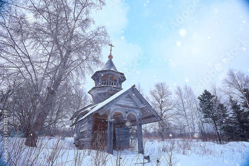 wooden church in the forest winter / landscape christian church in the winter landscape, view of the wooden architecture in the north
