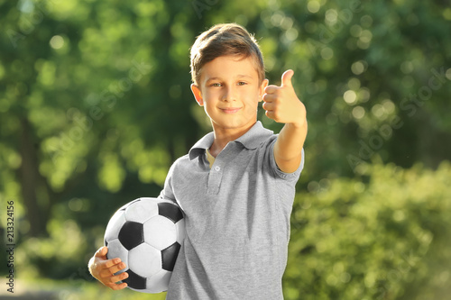 Cute boy with soccer ball i...