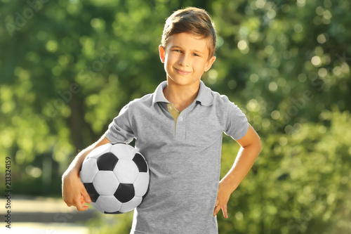 Cute boy with soccer ball i...