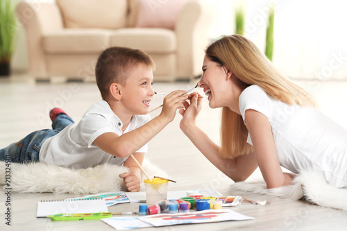 Mother with cute boy painti...