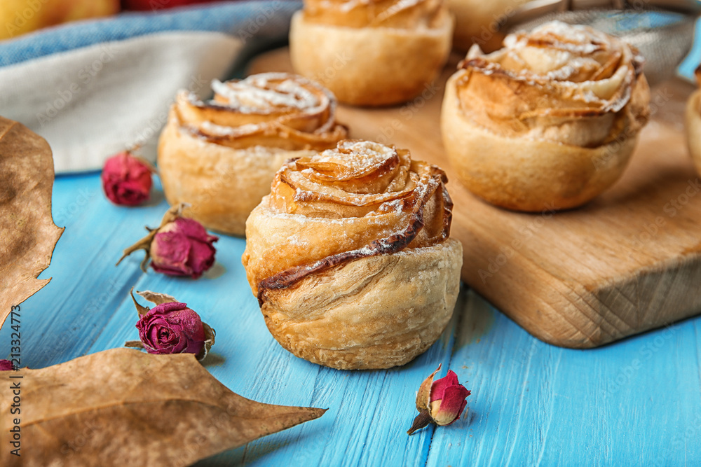 Rose shaped pastry with apple filling on table Rose shaped pastry with apple filling on table