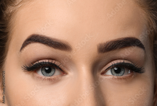 Young woman with beautiful eyebrows, closeup