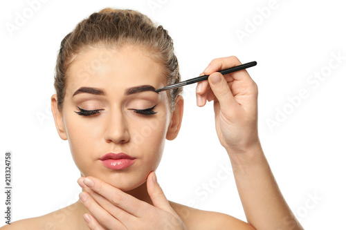 Young woman undergoing eyeb...