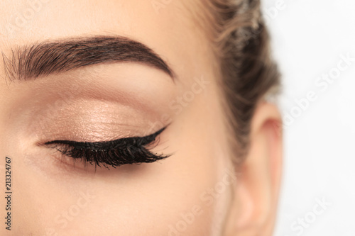 Eye of young woman with bea...