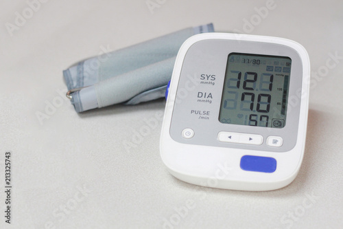 Autonamic blood pressure  showing a normal blood pressure on white background.spot focus.