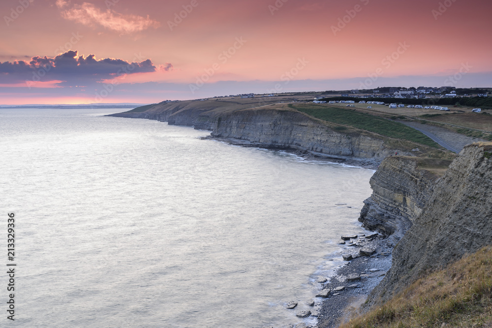 Fototapeta premium Spectacular sunset over Dunraven Bay, on the coast of South Wales, UK. Dunraven Bay is also know as Southerndown and featured as Bad Wolf Bay in the science fiction series of Dr Who
