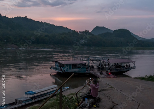 Impressive sunset on the banks of the Mekong River  Luang Prabang  Laos