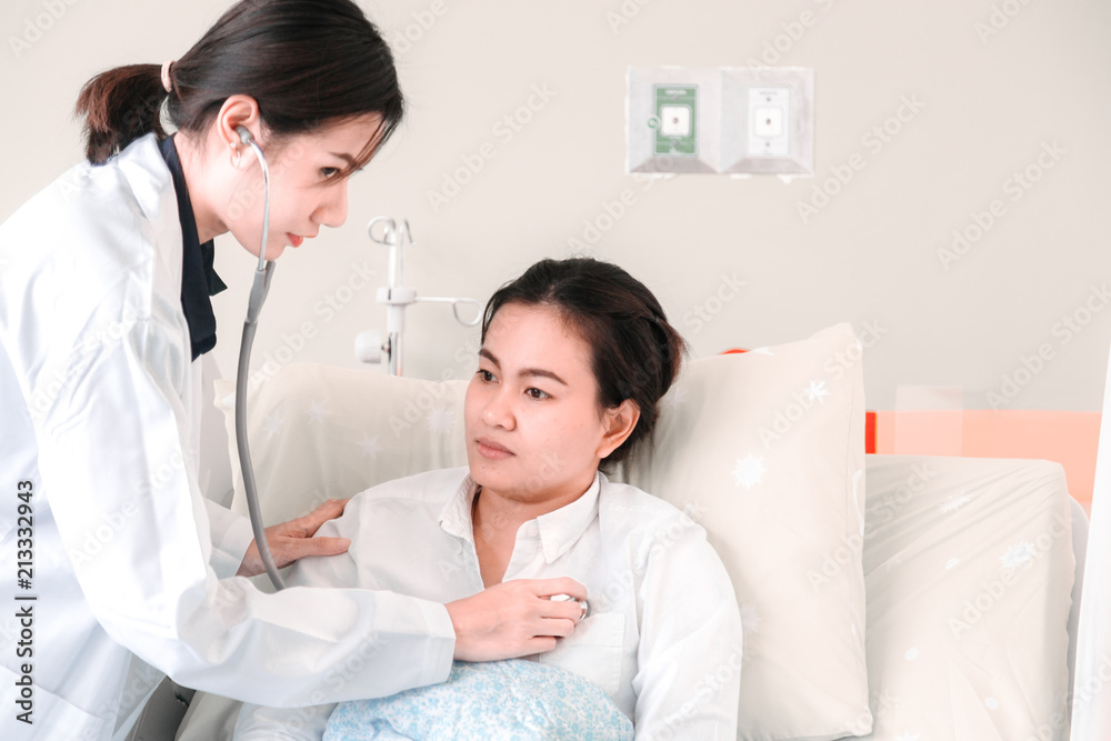 Fototapeta premium Medical at the hospital checking paperwork and patient's medical records