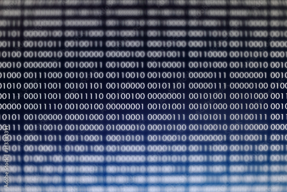 blocks of binary data. Blockchain concept. blue background with computer digital binary code bit number one and zero text. selective focus on the far end of the computer display out of focus in front. blocks of binary data. Blockchain concept. blue background with computer digital binary code bit number one and zero text. selective focus on the far end of the computer display out of focus in front.