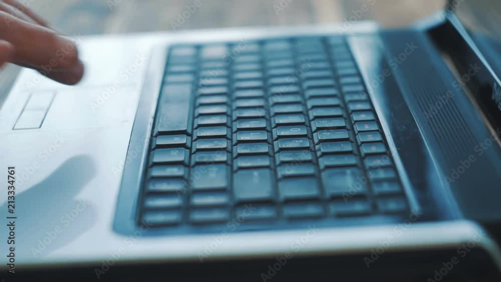 Man Fingers Taping Keyboard Notebook Computer. Close up. Man Fingers Taping Keyboard Notebook Computer. Close up.