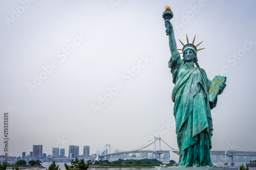 Statue of liberty and tokyo cityscape  Japan