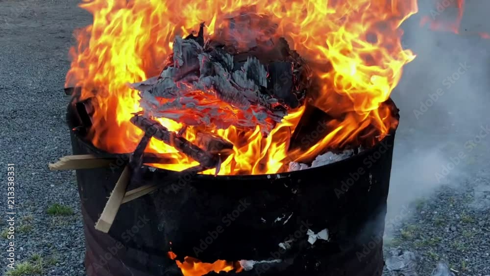 Fire in an oil drum, burning waste materials Fire in an oil drum, burning waste materials