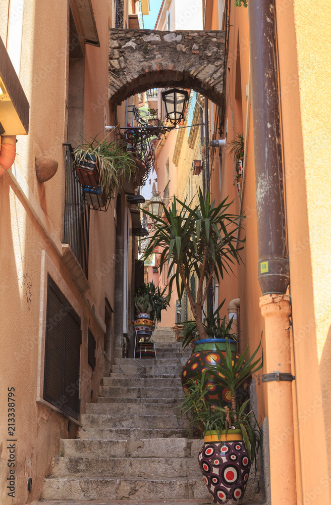 Historical center of Taormina, Sicily. Charming alley decorated with ceramics