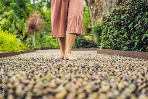 Foto Woman Walking On A Textured Cobble Pavement, Reflexology