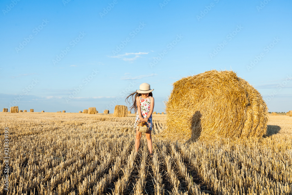 Happy girl on field of wheat with bread Happy girl on field of wheat with bread