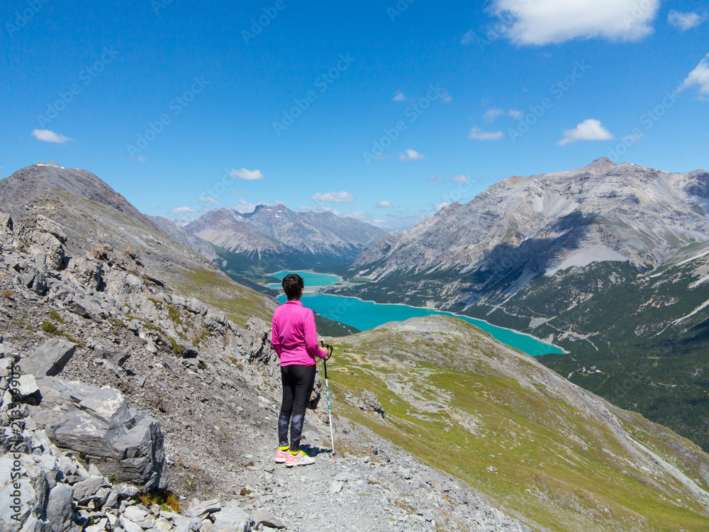 Hiker looks a panorama in mountain