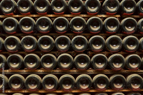 Stack of wine bottles in winery