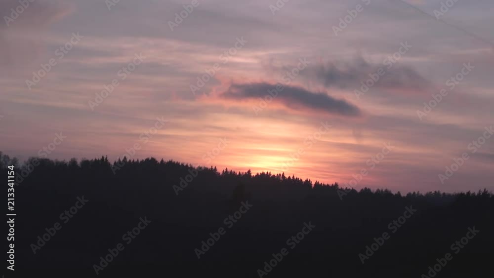 Deforming cloud captured with a sunset in the background Deforming cloud captured with a sunset in the background