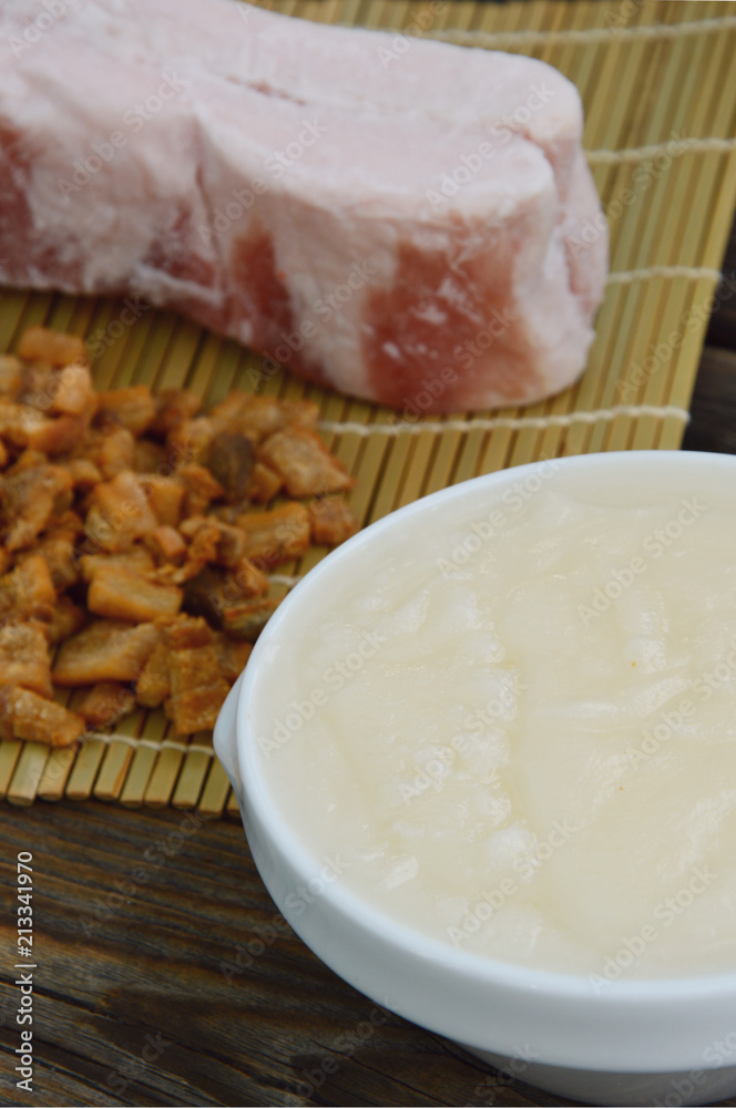 Lard bacon and crackling on wooden background and bamboo background. Lard bacon and crackling on wooden background and bamboo background.