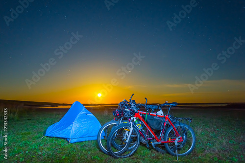 touristic camp with bicycle at the night