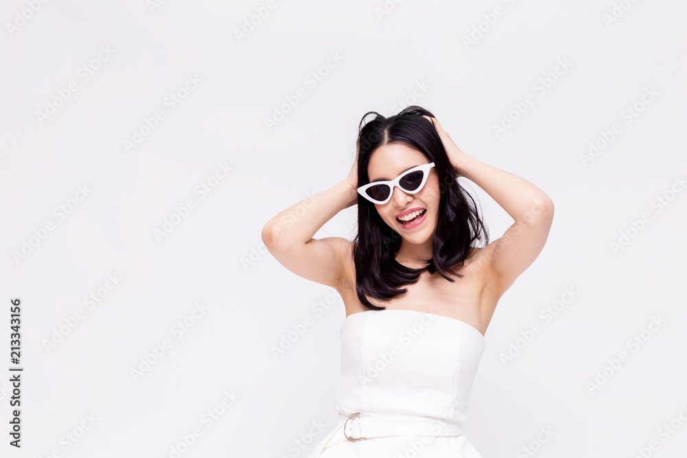 Elegant and attractive Asian chic fashion woman in stylish white dress with sunglasses in isolated background. Elegant and attractive Asian chic fashion woman in stylish white dress with sunglasses in isolated background.