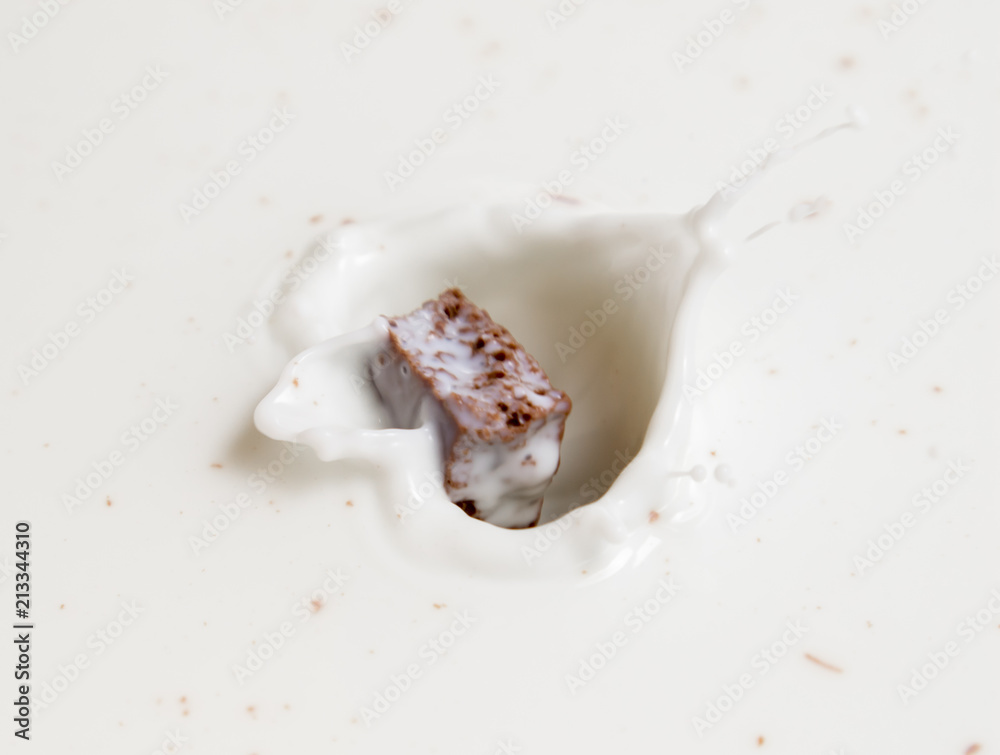 Chocolate falls in milk