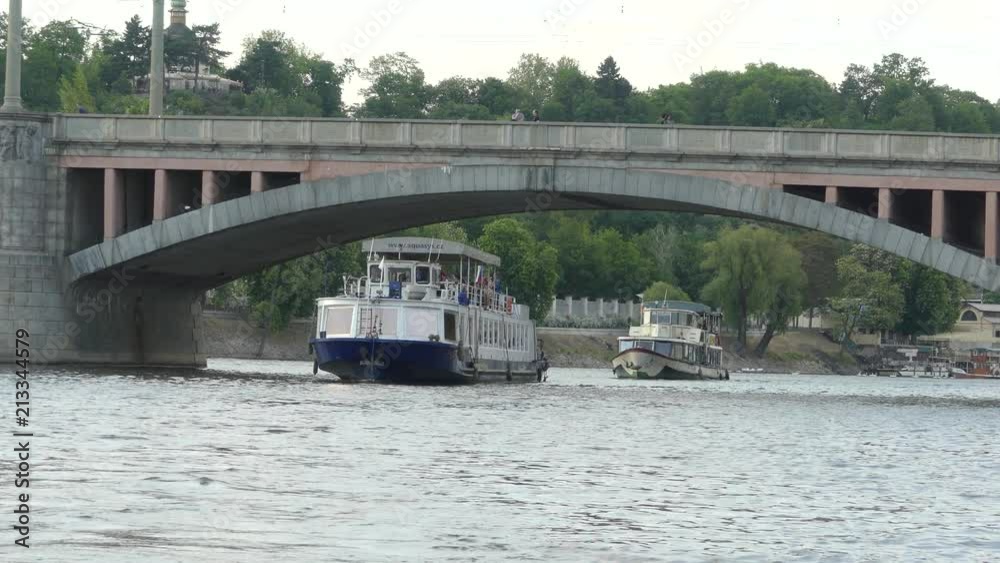 View of the Vltava River. Bridge over the Vltava River. The ship sails by Vltava River. View of the Vltava River. Bridge over the Vltava River. The ship sails by Vltava River.