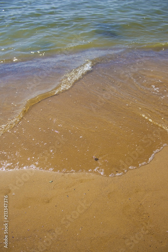 Soft wave of the sea on the sandy beach