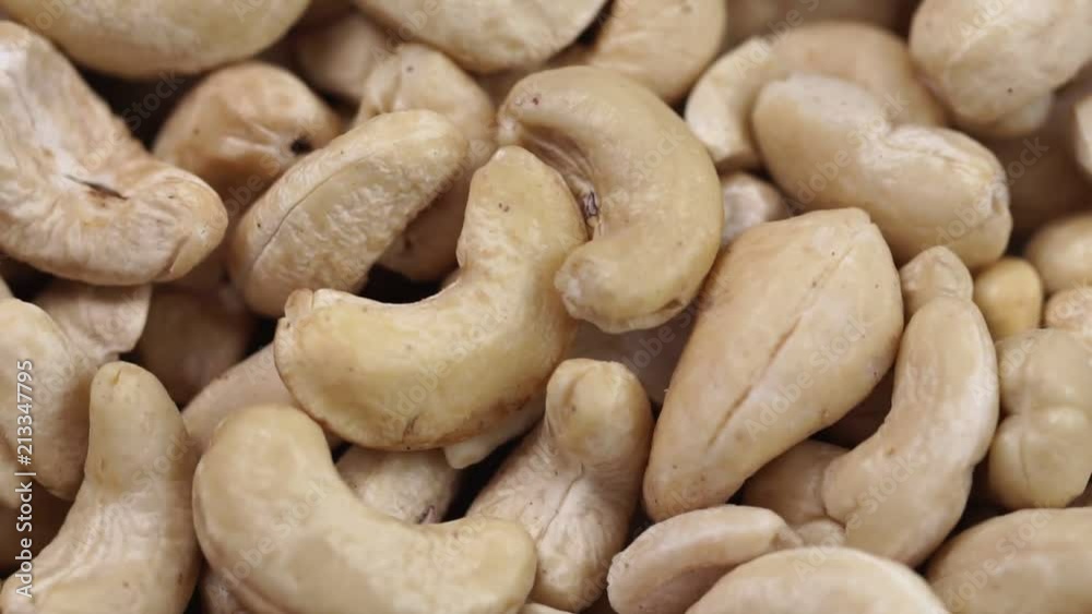 Cashew closeup. Rotating nuts background Cashew closeup. Rotating nuts background