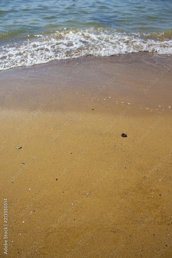 Soft wave of the sea on the sandy beach Soft wave of the sea on the sandy beach