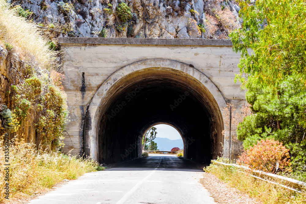 Empty mountani road with tunnel in Pellegrino mount in Palermo, Sicily.