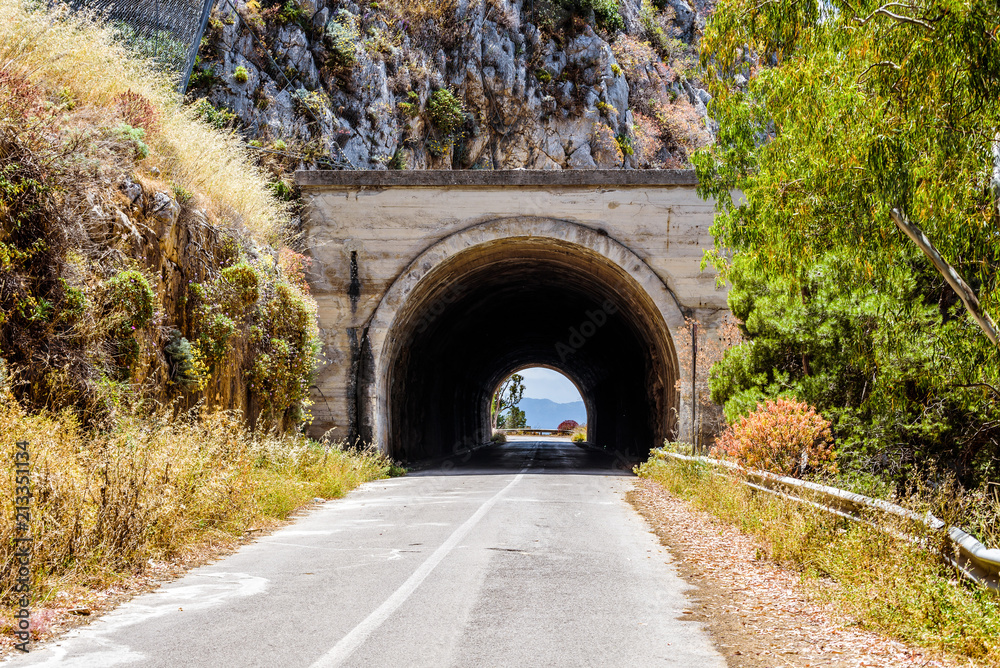 Empty mountani road with tunnel in Pellegrino mount in Palermo, Sicily.